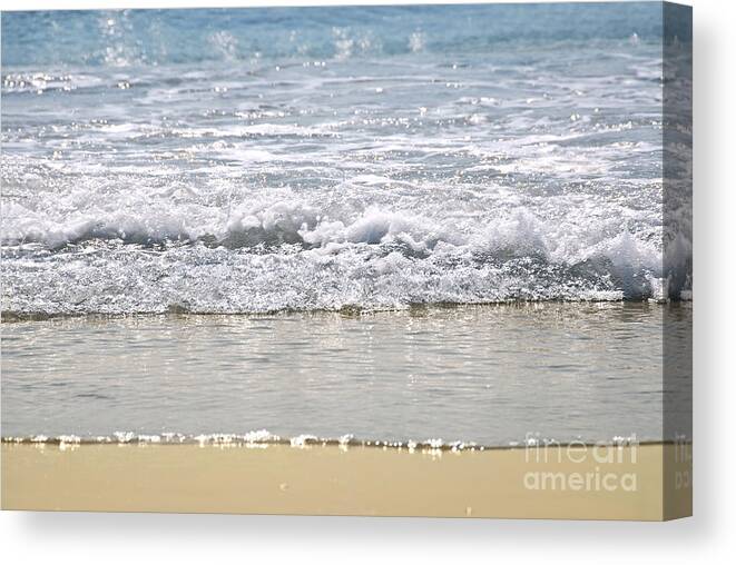 Water Canvas Print featuring the photograph Ocean shore with sparkling waves by Elena Elisseeva