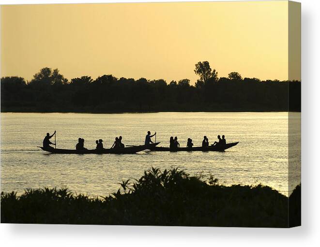 Tranquility Canvas Print featuring the photograph Paddling on the Niger River at sunset by Shanna Baker