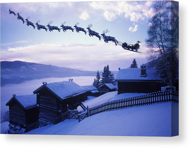 Log Cabin Canvas Print featuring the photograph Santa Clause with reindeer flying above a farm by Per Breiehagen