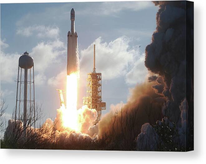 Spacex Canvas Print featuring the photograph Spacex To Launch First Heavy Lift by Joe Raedle