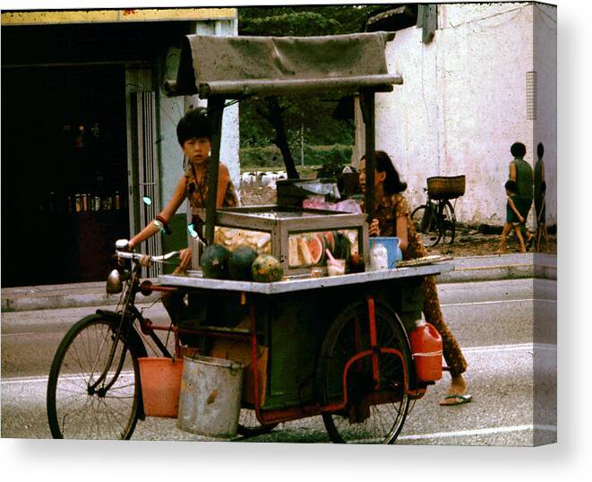  Canvas Print featuring the photograph Street Vendor by John Warren