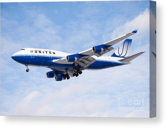 747 Canvas Print featuring the photograph United Airlines Boeing 747 Airplane Landing by Paul Velgos