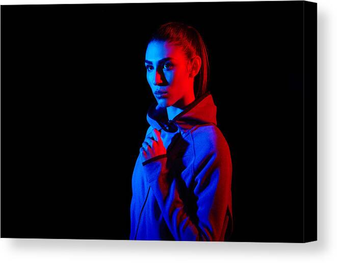 People Canvas Print featuring the photograph Young Woman Photographed With Creative Lighting by Mads Perch