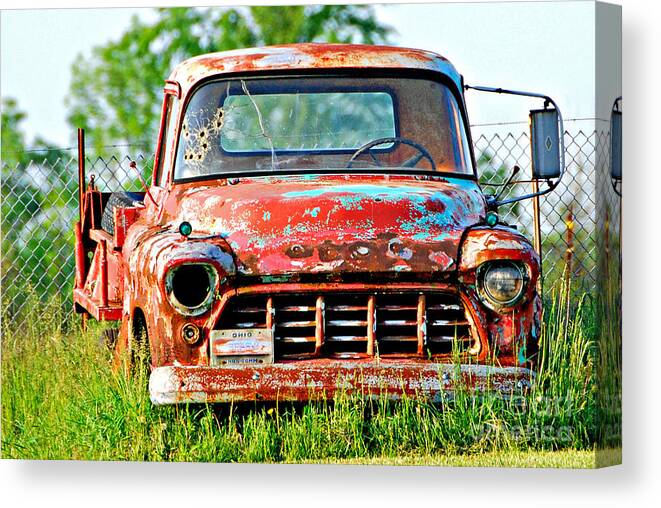 Bullet Hole Forgotten Truck Print Canvas Print featuring the photograph Bullet Hole Forgotten Truck by Lila Fisher-Wenzel