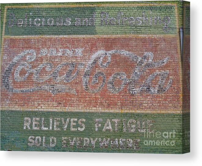 Coca Cola. Signs Canvas Print featuring the photograph Old Coca Cola painted Brick Wall by Doris Blessington