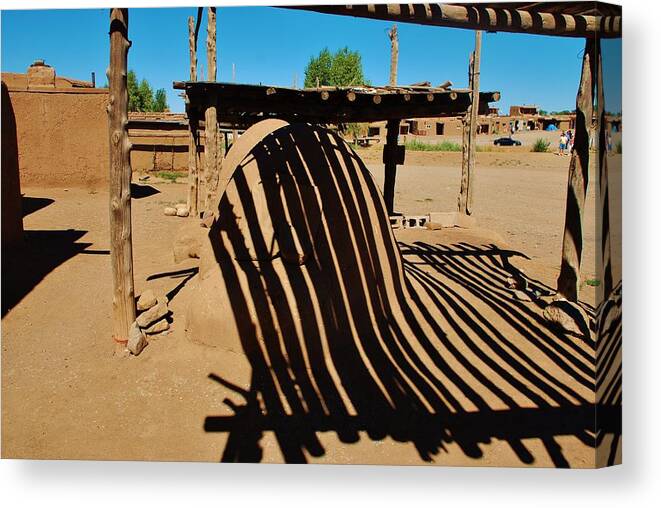 Taos Pueblo Canvas Print featuring the photograph Taos Pueblo reflections by Dany Lison