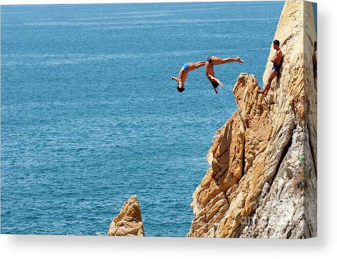 Cliff Divers Canvas Print featuring the photograph Famous cliff diver of Acapulco Mexico #2 by Anthony Totah
