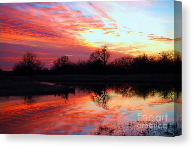 Clouds Canvas Print featuring the photograph Calming Sunset by Larry Keahey