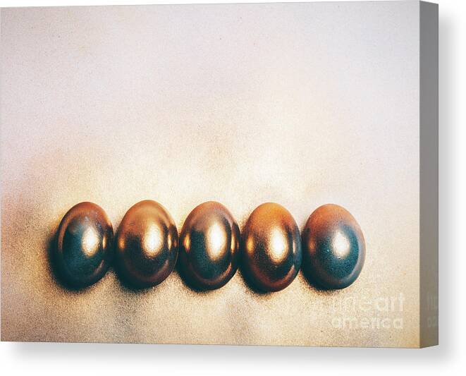 Egg Canvas Print featuring the photograph Five golden eggs laying on the floor. by Michal Bednarek
