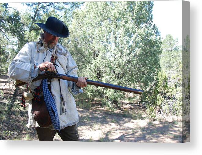 Mountain Man Canvas Print featuring the photograph Mauntain man and his black powder rifle by Irina ArchAngelSkaya