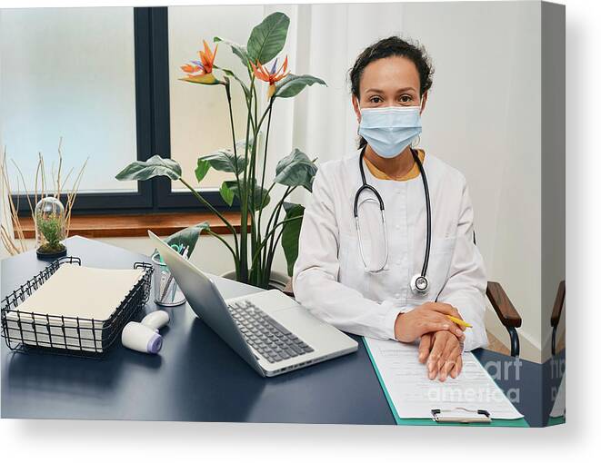 Doctor Canvas Print featuring the photograph Doctor Wearing Face Mask #1 by Peakstock / Science Photo Library