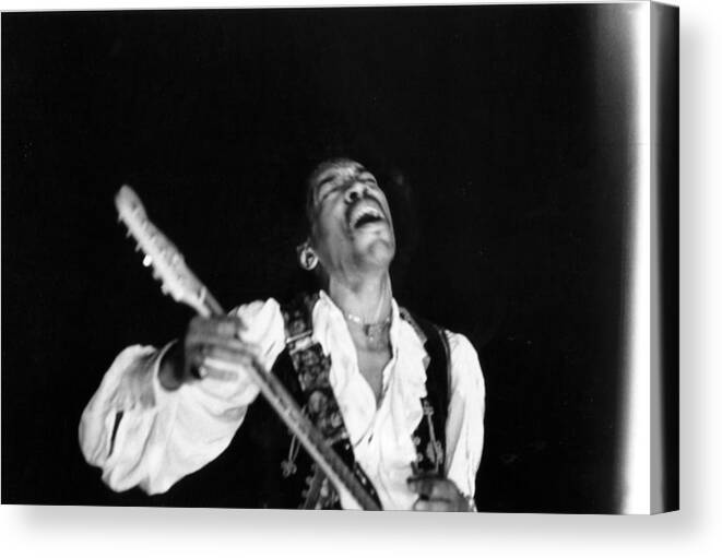Music Canvas Print featuring the photograph Jimi Hendrix Performs At Monterey by Michael Ochs Archives