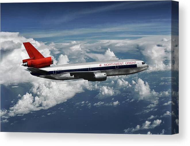 Northwest Orient Airlines Canvas Print featuring the mixed media Among the Clouds - Northwest Orient DC-10-40 by Erik Simonsen