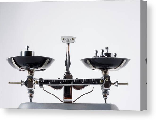 White Background Canvas Print featuring the photograph Balance Scales With Metal Weights by Vladimir Godnik