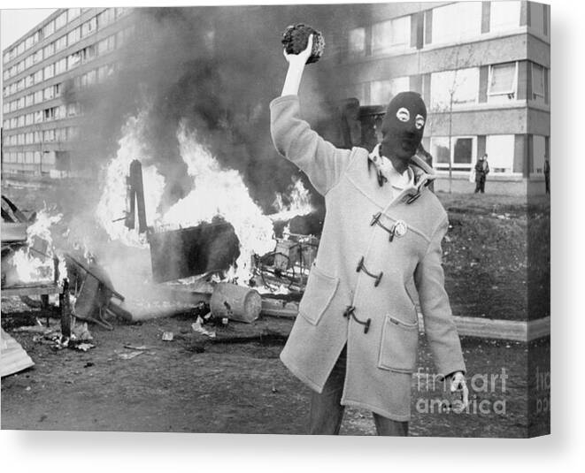 Belfast Canvas Print featuring the photograph Belfastmasked Protester On Riot Torn by Bettmann