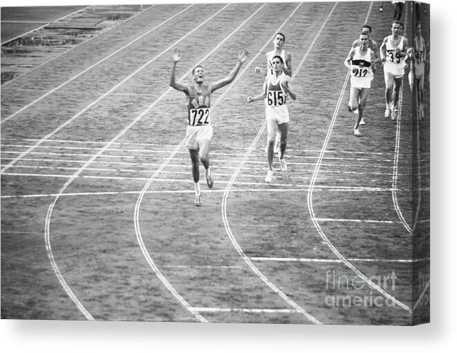 Young Men Canvas Print featuring the photograph Billy Mills Winning Race In Olympics by Bettmann