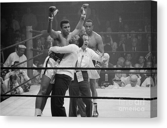 Human Arm Canvas Print featuring the photograph Boxer Muhammad Ali Defeating Sonny by Bettmann