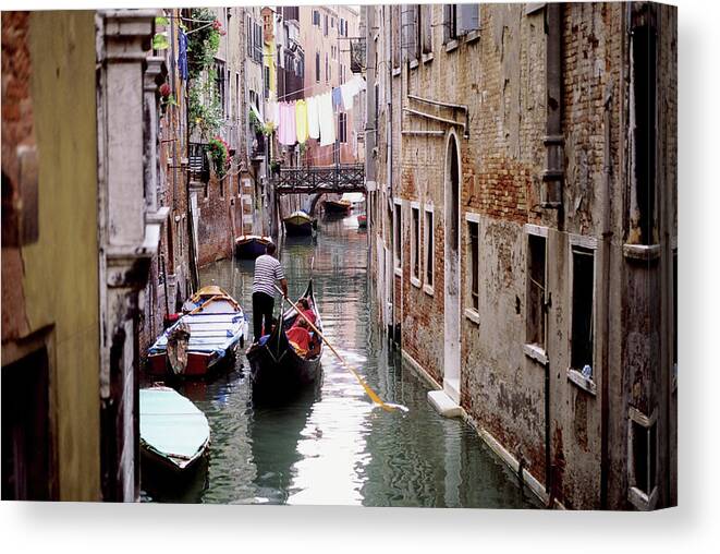Hanging Canvas Print featuring the photograph Clothes Hanging Over Ghetto Canal by Medioimages/photodisc