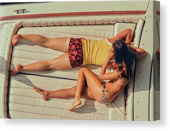 #new2022 Canvas Print featuring the photograph Couple Lying Face Down On A Boat by Douglas Mesney