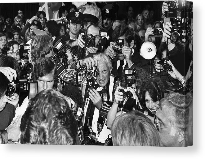 Crowd Canvas Print featuring the photograph Hollywood Paparazzi At The Premiere Of by George Rose