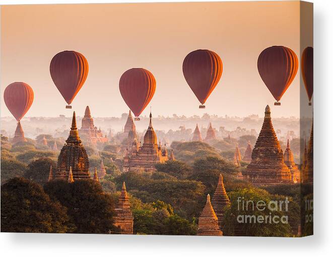 Dusk Canvas Print featuring the photograph Hot Air Balloon Over Plain Of Bagan by Lkunl