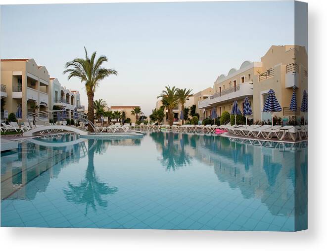 Dawn Canvas Print featuring the photograph Hotel Swimming Pool At Dawn by Pidjoe