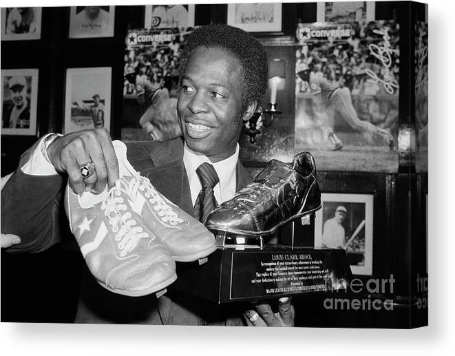 St. Louis Cardinals Canvas Print featuring the photograph Lou Brock Holding Shoes And Shoe Trophy by Bettmann