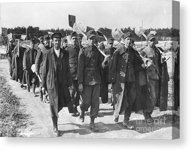 Marching Canvas Print featuring the photograph Polish War Prisoners Are Marching To Wor by Bettmann