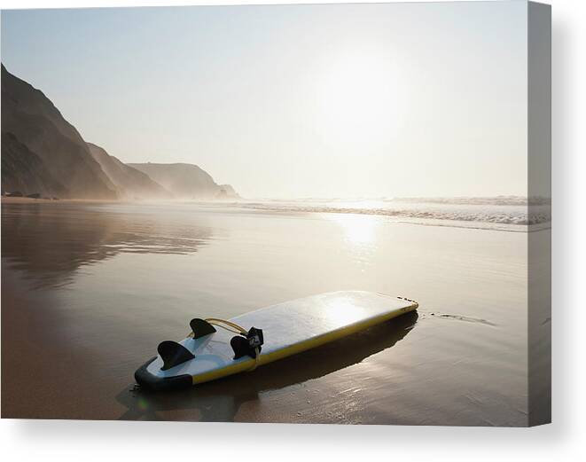 Algarve Canvas Print featuring the photograph Portugal, Surfboard On Beach by Westend61