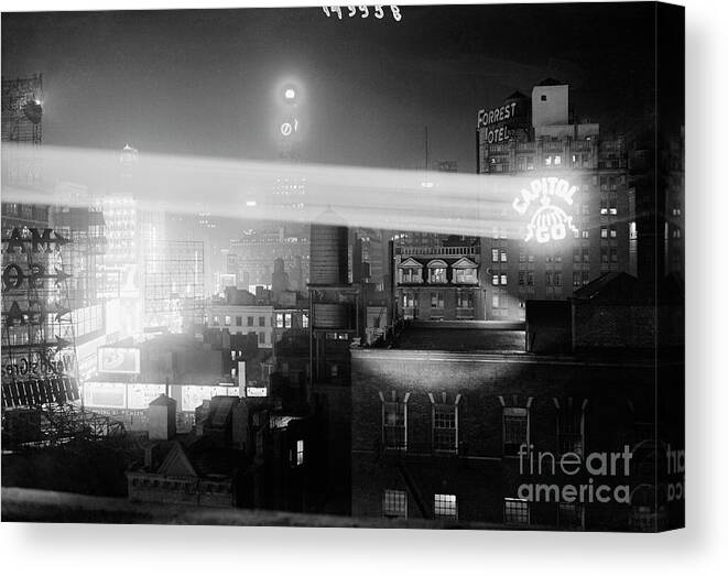 Finance And Economy Canvas Print featuring the photograph Projecting Ad On Skyscrapers by Bettmann