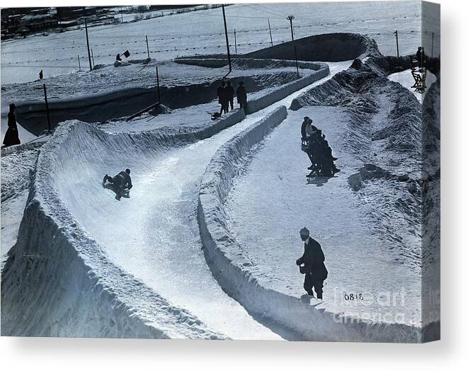 People Canvas Print featuring the photograph Sledders On Banked Turn by Bettmann