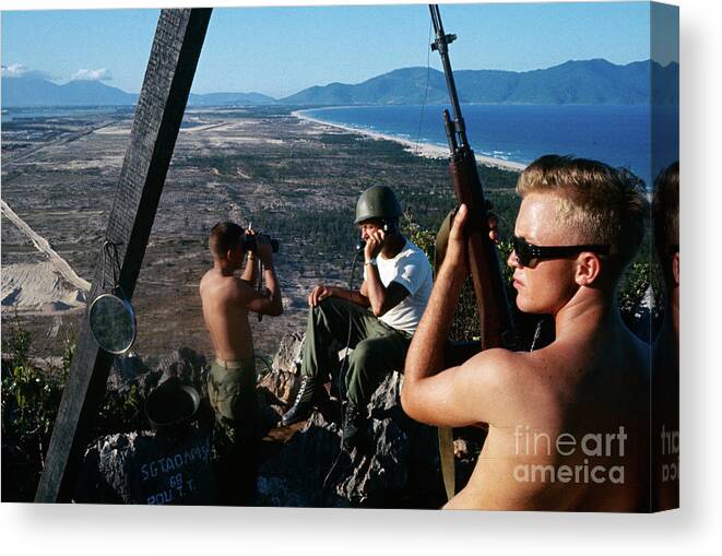 Young Men Canvas Print featuring the photograph Soldiers Keeping Lookout Over Us Airbase by Bettmann