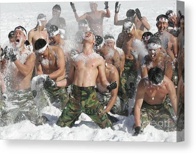 Snow Canvas Print featuring the photograph South Korean Soldiers Undertake by Chung Sung-jun