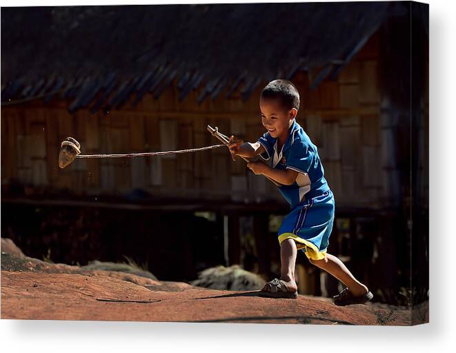 Action Canvas Print featuring the photograph Spin Topper by Vichaya