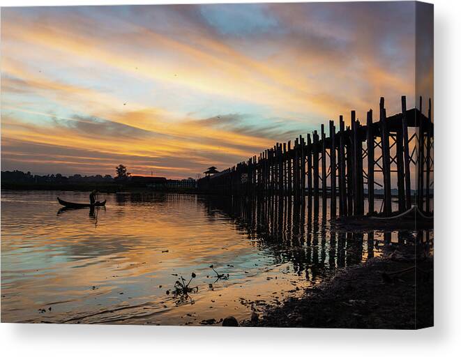 Fishing Canvas Print featuring the photograph sunrise at U Bein Bridge, Mandalay, Myanmar by Ann Moore