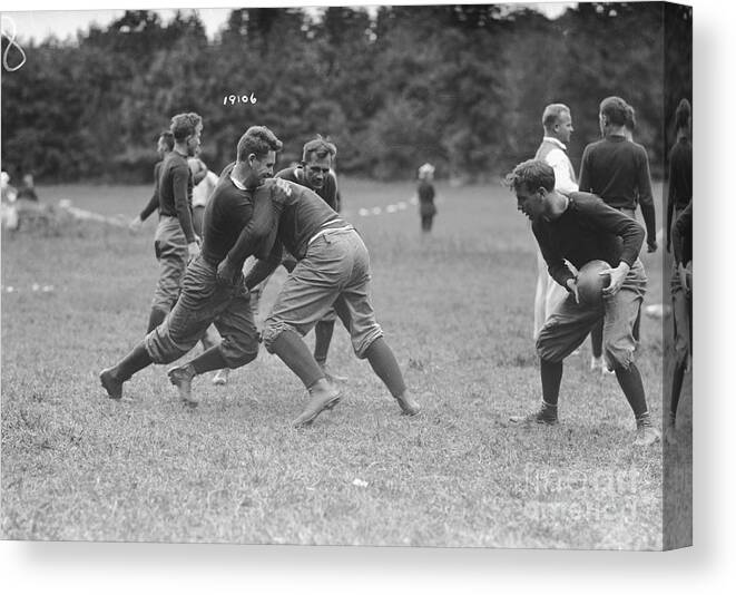People Canvas Print featuring the photograph Yale Football Teammates Practicing by Bettmann