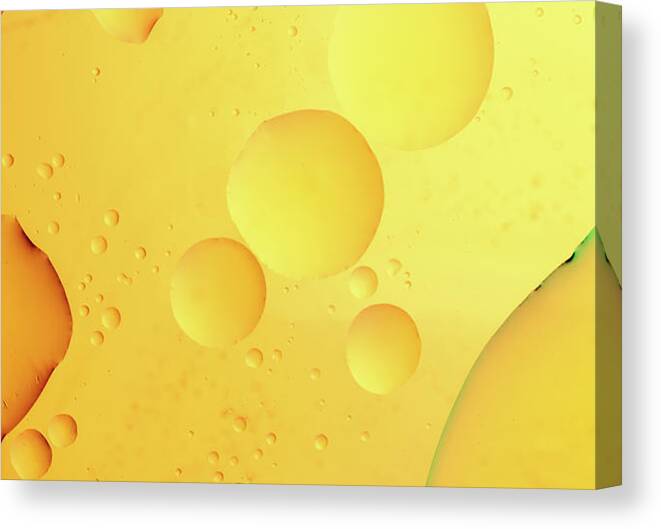 Fluid Canvas Print featuring the photograph Abstract, image of oil, water and soap with colourful background by Michalakis Ppalis
