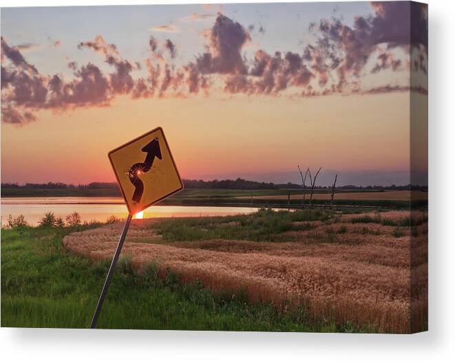 Sign Curve Scenic Landscape North Dakota Lake Syzygy Alignment Sun Pinhole Roadsign Hunting Bullet Humor Star Bullet Hole Shooting Shot Canvas Print featuring the photograph Dodged a Bullet - curve in road sign with sunlight through bullet hole by Peter Herman