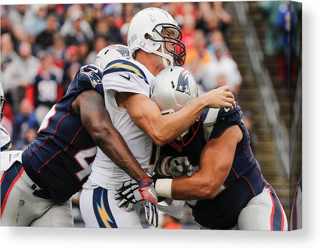 Three Quarter Length Canvas Print featuring the photograph Los Angeles Chargers v New England Patriots #1 by Jim Rogash