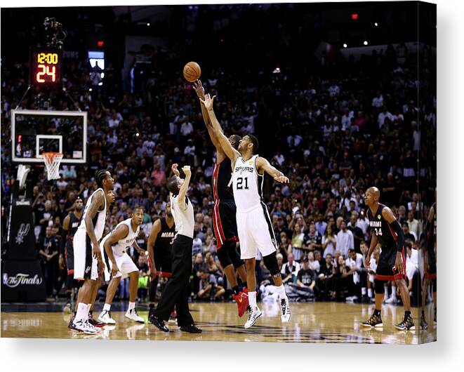 Playoffs Canvas Print featuring the photograph Tim Duncan and Chris Bosh #1 by Andy Lyons