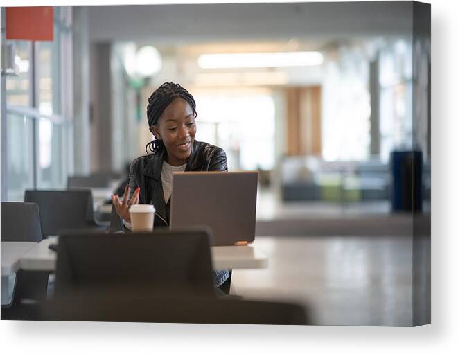 Desk Canvas Print featuring the photograph University student at work during COVID-19 #2 by FatCamera
