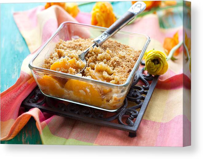 Orange Color Canvas Print featuring the photograph A bowl of peach crumble on a black plate by Sarsmis