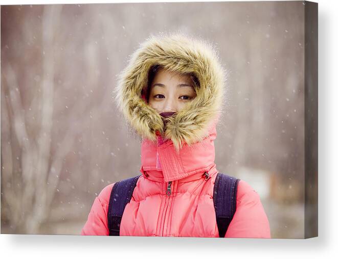 Beautiful Woman Canvas Print featuring the photograph Asian girl in snowing day by Lawren