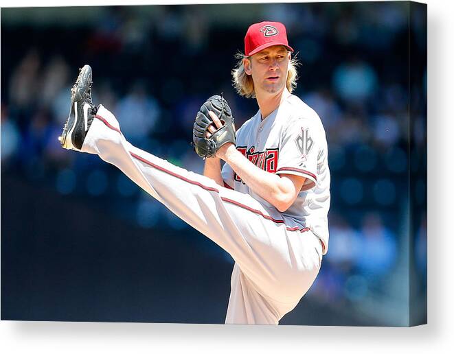 American League Baseball Canvas Print featuring the photograph Bronson Arroyo by Mike Stobe