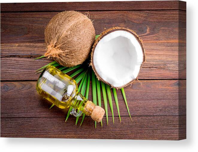 Wood Canvas Print featuring the photograph Coconut and coconut oil by Aedkais