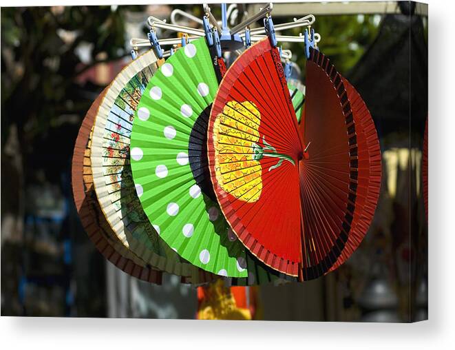 Cool Attitude Canvas Print featuring the photograph Colourful Spanish fans for sale in marketplace by Lyn Holly Coorg