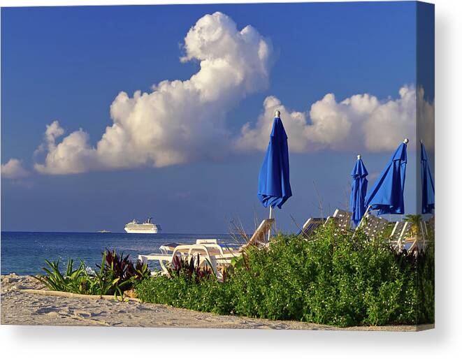 Cozumel Canvas Print featuring the photograph Cozumel Cruise Blues - Cruise ship off the beach of Cozumel Mexico with Blue beach umbrellas by Peter Herman
