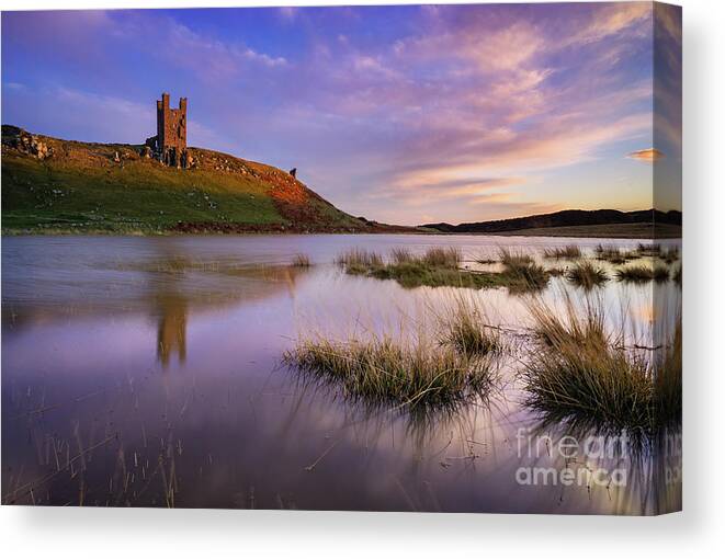 Sunset Canvas Print featuring the photograph Dunstanburgh Castle reflections at sunset Embleton Bay, Northumberland, England by Neale And Judith Clark