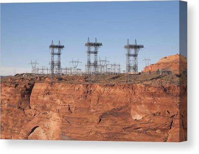 Environmental Conservation Canvas Print featuring the photograph Electricity pylons over a dam by Fotosearch