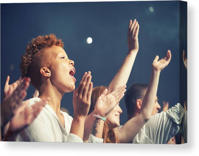 Event Canvas Print featuring the photograph Getting in tune with the music by PeopleImages